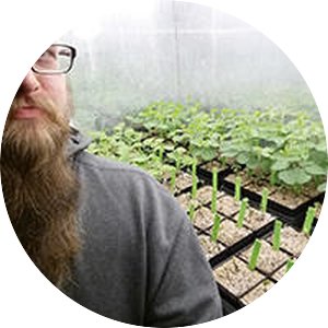 James Menger in a greenhouse